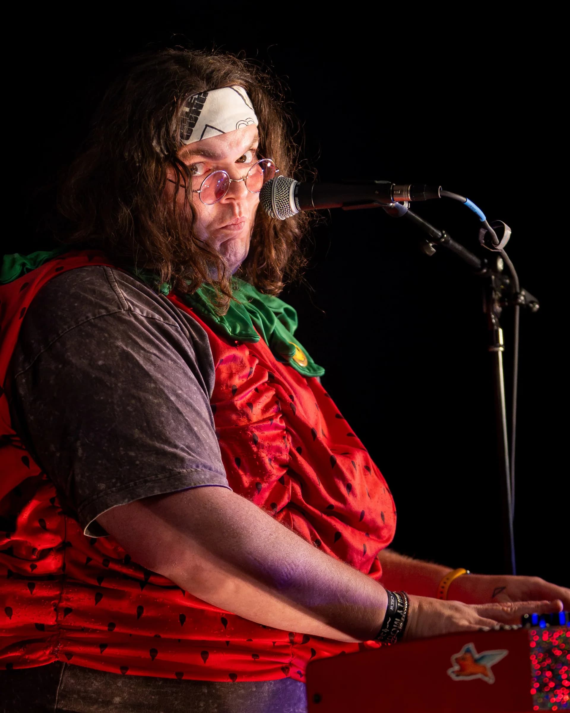 Sweet N’ Juicy, in costume, on stage at Juniper Jam after dark, September 5, 2026.
